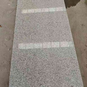 梧州芝麻白光面毛板