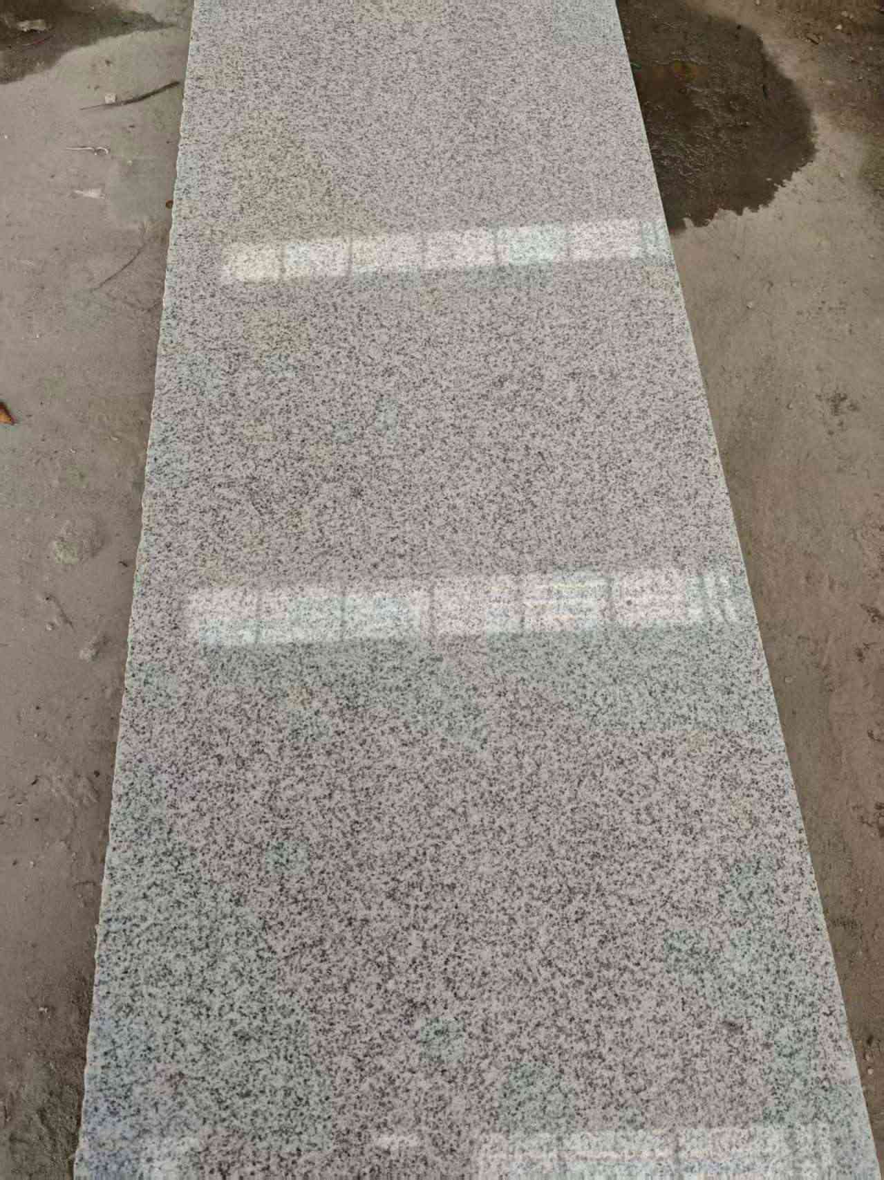 梧州芝麻白光面毛板